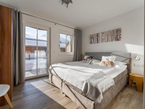 Postel nebo postele na pokoji v ubytování Luxury Tauern Suite Walchen Kaprun 6