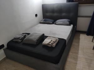 A bed or beds in a room at Mini Deluxe Room - Close to Metro C