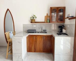 a kitchen with a sink and a counter top at Encanto De Mimi 2 in Puerto Ayora