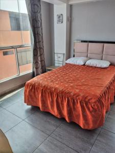 Ένα ή περισσότερα κρεβάτια σε δωμάτιο στο Residencial Rancagua