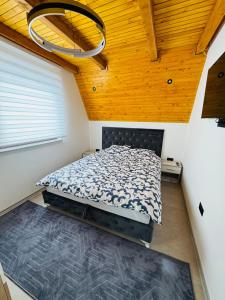 Postel nebo postele na pokoji v ubytování Weekend house - Vlašić