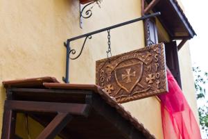 a sign hanging on the side of a building at Spot Hotel in Rhodes Town