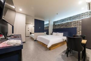 Pyeongtaek Gallery Hotel客房内的一张或多张床位