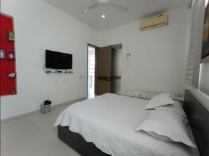 Кровать или кровати в номере ESPECTACULAR CASA QUINTA EN MELGAR con PISCINA PRIVADA +20 фотографий