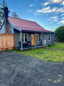 a small house with a red roof at Forks Cedar House in Forks
