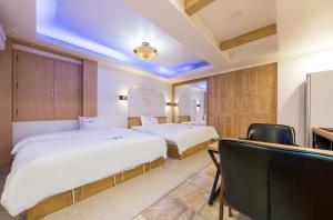 Postel nebo postele na pokoji v ubytování Pyeongtaek Gallery Hotel + 37 fotografií