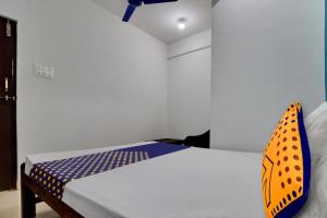 Postel nebo postele na pokoji v ubytování Hotel O U & I LIVINGS + 20 fotografií