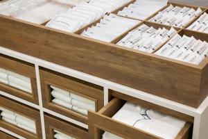 a drawer full of white towels in a cabinet at Four Points Flex by Sheraton Kyoto Oike in Kyoto