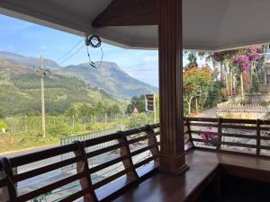 a balcony with a view of a mountain at Mountain Breeze Resort Vattavada in Munnar