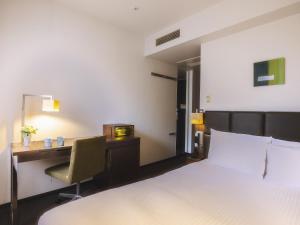 Postel nebo postele na pokoji v ubytování Hotel Gracery Tokyo Tamachi