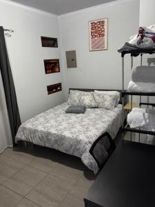 Una cama o camas en una habitación de Schultz Apartamento