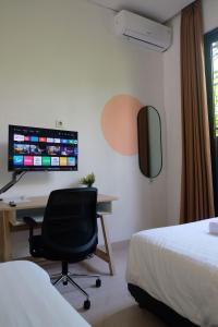 TV a/nebo společenská místnost v ubytování Olivia SOHO Guest House