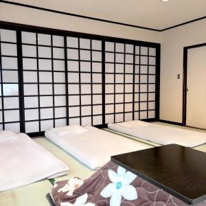 Postel nebo postele na pokoji v ubytování Guest House Vingt-Neuf 美好境界湯澤館