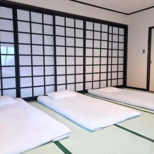 Postel nebo postele na pokoji v ubytování Guest House Vingt-Neuf 美好境界湯澤館