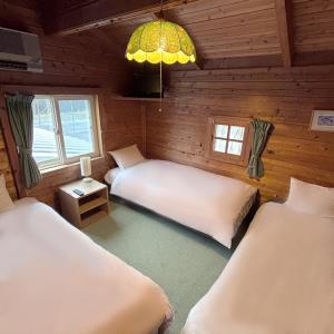 Postel nebo postele na pokoji v ubytování Guest House Vingt-Neuf 美好境界湯澤館