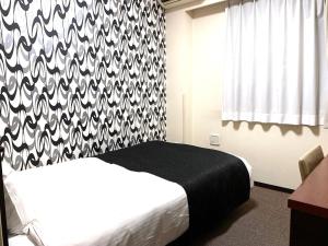 APA Hotel Keikyu Kamata Ekimae Nishi客房内的一张或多张床位