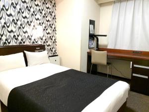 APA Hotel Keikyu Kamata Ekimae Nishi客房内的一张或多张床位