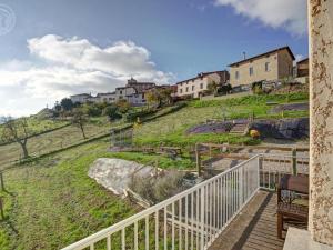 a view of a hill with houses on it at Gîte rural avec jardin, parking et WiFi - Saint-Romain-en-Jarez - FR-1-496-295 in Saint-Romain-en-Jarez