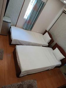Voodi või voodid majutusasutuse Hanoi Carina Hotel toas