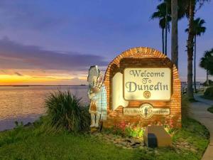a welcome to durricular sign in front of the water at 719 Douglas Avenue, Unit D "Skye" in Dunedin