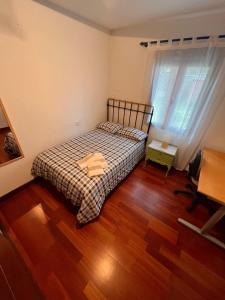 En eller flere senge i et værelse på Carmen Horcajo