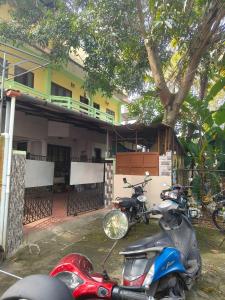 a couple of motorcycles parked in front of a building at Queen Mary's Homestay India kerala kochi in Cochin