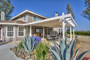 a house with a patio and some plants in front of it at Casa Rosé in Temecula