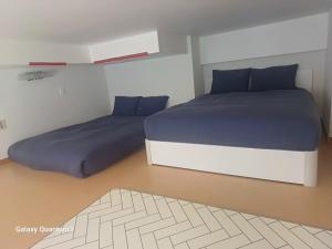 A bed or beds in a room at Hongdae Residence - 1min from Hongik Uni station Exit #1