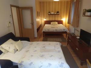 Postel nebo postele na pokoji v ubytování Gonda Apartments