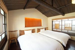 Postel nebo postele na pokoji v ubytování 二条城北別邸 -Nijojo Kita Betttei-