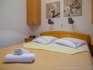 Postel nebo postele na pokoji v ubytování Rosemarie Vodice