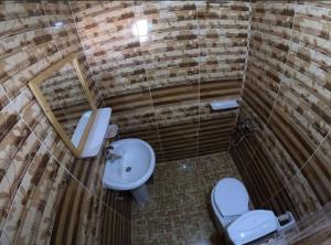 an overhead view of a bathroom with a toilet and sink at ACACIA Camp in Nuweiba