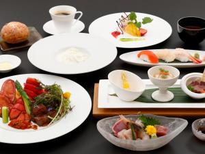 a group of plates of food on a table at Furano Resort Orika in Nakafurano