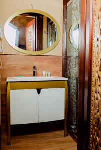 a bathroom with a sink and a mirror at Royal Historical Boutique Hotel in Baku +42 photos