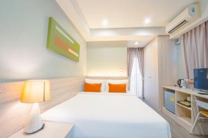 Koon Hotel Sukhumvit客房内的一张或多张床位