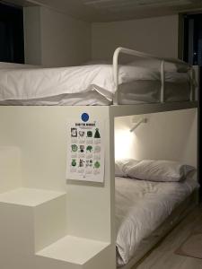 Postel nebo postele na pokoji v ubytování SSH ES Dream tower
