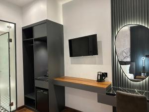 TV a/nebo společenská místnost v ubytování LION 11 Can Tho Hotel