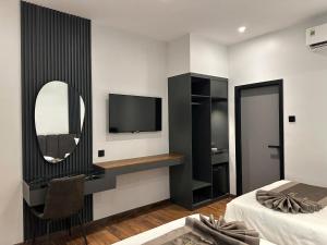 TV a/nebo společenská místnost v ubytování LION 11 Can Tho Hotel
