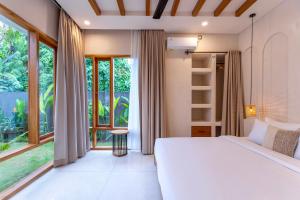 Postel nebo postele na pokoji v ubytování Maliya Villa by Betterplace