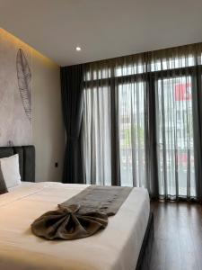 Postel nebo postele na pokoji v ubytování LION 11 Can Tho Hotel