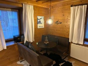 a dining room with a table and chairs at Kitzbühel City Appartement in Kitzbühel