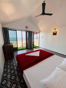 Postel nebo postele na pokoji v ubytování Casa Beach hut Resort