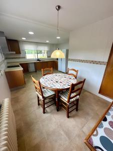 a dining room table and chairs in a kitchen at Chalet Borriol Golf REF 028 in Borriol