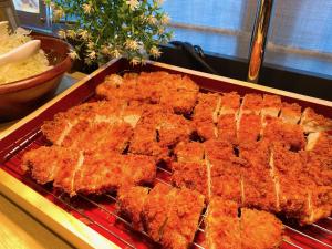 a tray of fried food on a grill at Almont Hotel Nippori in Tokyo