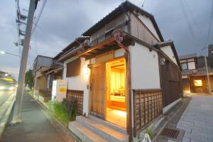 a small house on the side of a street at 伏見稲荷の宿-Inari no Yado- in Kyoto