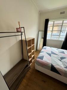a bedroom with a bed and a window at Room near to Melbourne Airport & Train Station in St Albans