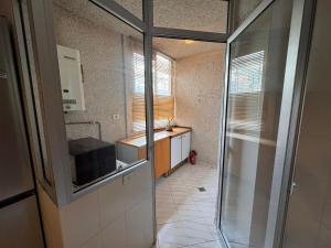 a small kitchen with a sink and a microwave at Alquilaencanarias Tabaiba vista mar in Tabaiba +21 photos