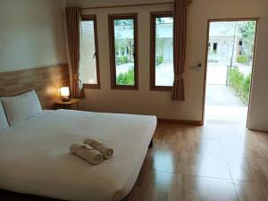 Postel nebo postele na pokoji v ubytování Three Bays Resort