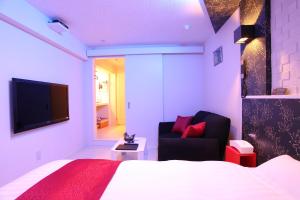 TV a/nebo společenská místnost v ubytování Town Hotel 41