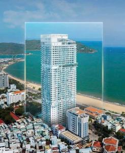 an aerial view of a tall building next to the ocean at Căn hộ TMS Quy Nhơn KIM NGÂN in Quy Nhon